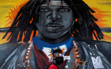 A man walks past a mural under an overpass in Port-au-Prince A man walks past a mural under an overpass in Port-au-Prince, Haiti July 26, 2021. REUTERS/Ricardo Arduengo TPX IMAGES OF THE DAY